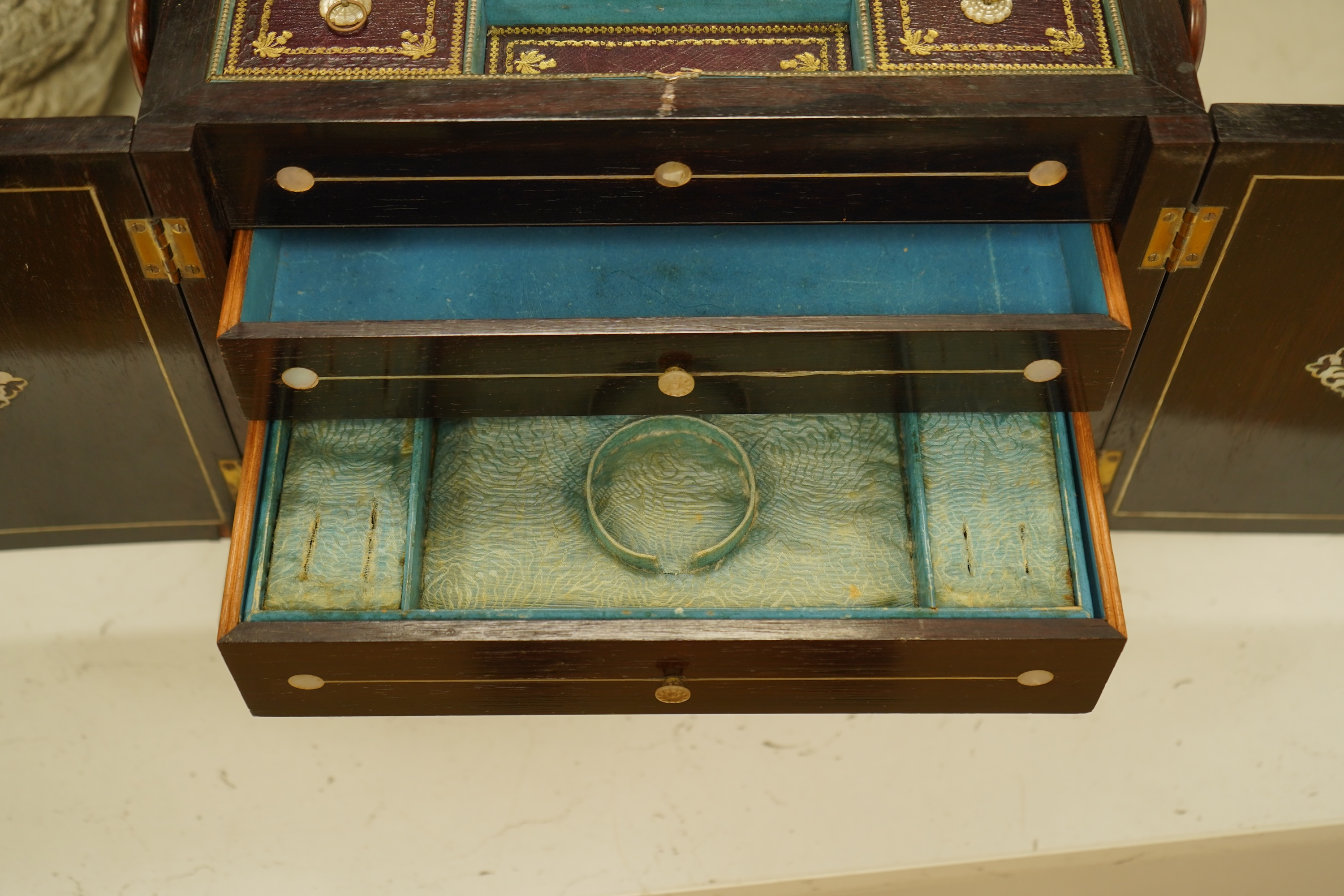 A William IV rosewood and mother of pearl inlaid sewing and writing cabinet with tooled Moroccan leather fitted interior, 37cm high